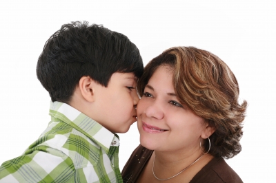 boy kisses mom