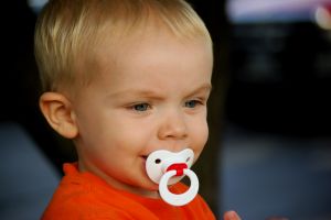 kid with pacifer